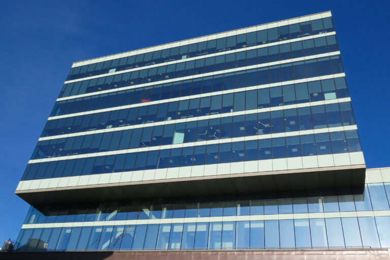 A glass-fronted office building at Stratford Place in London.